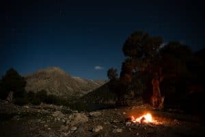 Campfire in a mountain valley